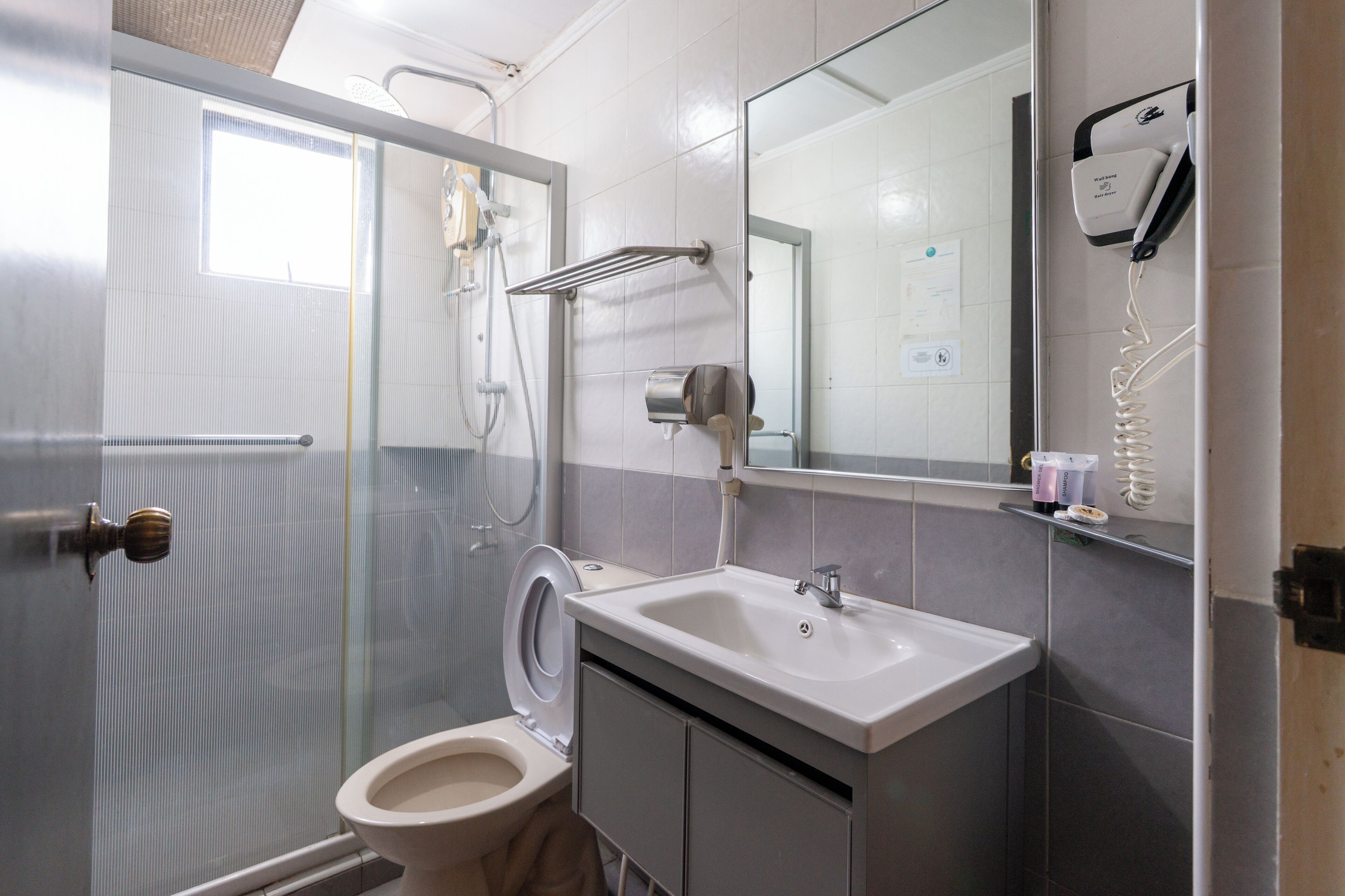 Shower, hair dryer, slippers, towels