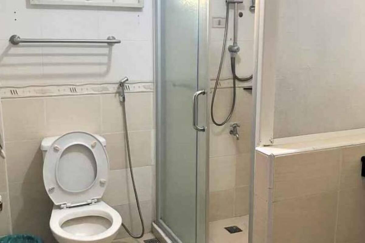 Bathroom | Shower, hair dryer, slippers, towels