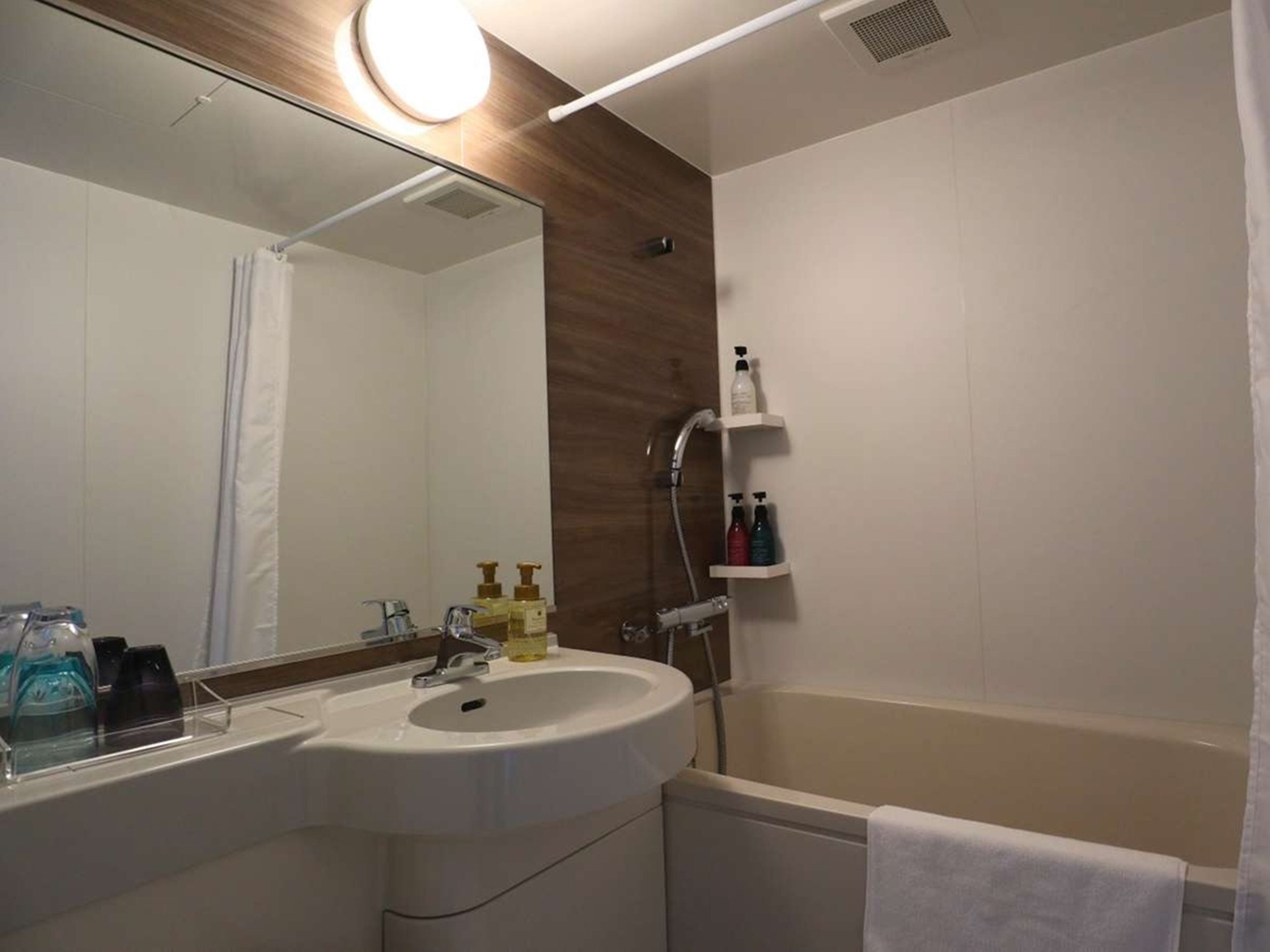 hair dryer, slippers, bidet, towels