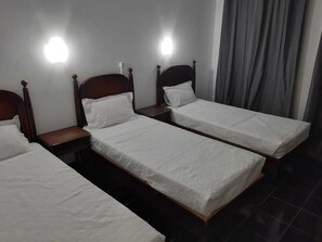 Desk, laptop workspace, bed sheets
