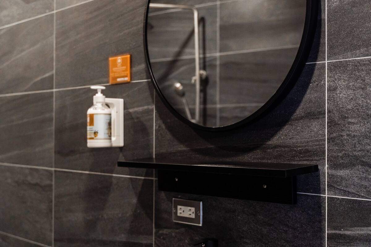 standard double room | bathroom | spring water bathtub, rainfall showerhead, free toiletries, hair dryer