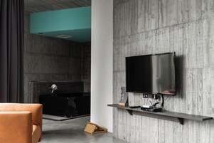 Deluxe Double Room | Bathroom | Spring water tub, rainfall showerhead, free toiletries, hair dryer