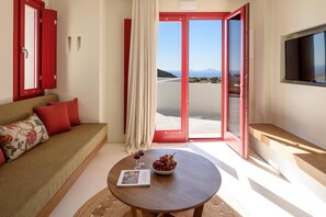 Elite Suite with Hot Tub and Sea View | Living area | 36-inch Smart TV with cable channels, TV - Potnia Theron Suites (Santorini)