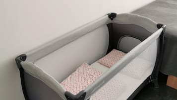 1 bedroom, desk, iron/ironing board, travel crib
