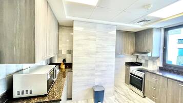 Deluxe Apartment (2 Bedrooms) | Private kitchen | Microwave, oven, coffee/tea maker, electric kettle