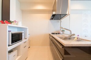 Condo | Private kitchenette | Fridge, microwave, stovetop, cookware/dishes/utensils - Longvacation Okinawa 210 (Onna)