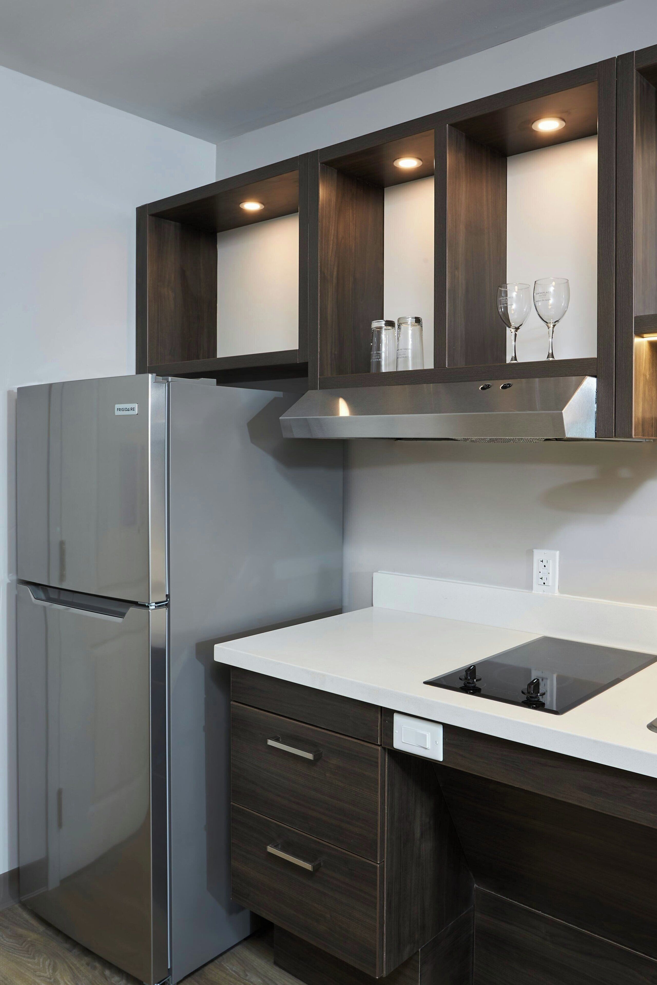 full-sized fridge, microwave, stovetop, dishwasher