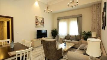 32-inch flat-screen TV with cable channels, TV, streaming services