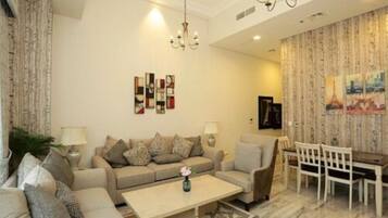 Apartment (2 Bedrooms) | Living room | 32-inch flat-screen TV with cable channels, TV, streaming services