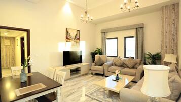 Apartment (2 Bedrooms) | Living room | 32-inch flat-screen TV with cable channels, TV, streaming services