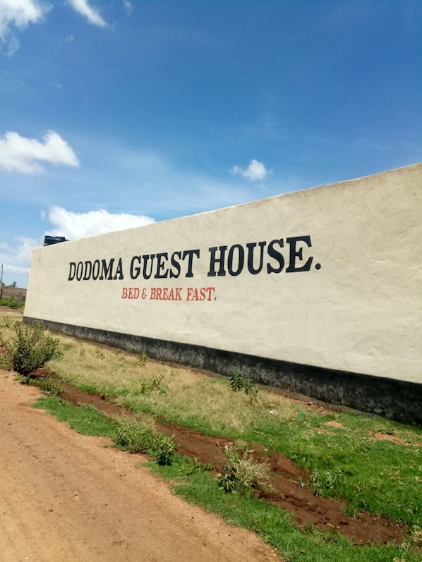 A sign for Dodoma Guest House advertising 'Bed & Break Fast.'
