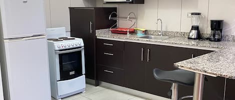 Fridge, microwave, coffee/tea maker, toaster