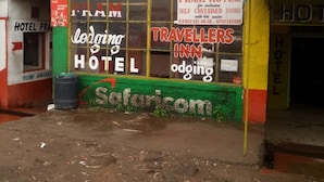 A building with signs for 'FRAMJOW HIGHWAY CLUB TRAVELLERS' and 'TRAVELLERS INN'. - Framjow Highway Lodge - Adults Only (Gilgil)