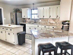 Microwave, dishwasher, coffee/tea maker, cookware/dishes/utensils
