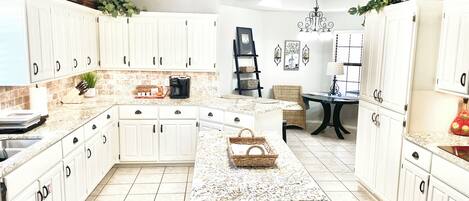 Microwave, dishwasher, coffee/tea maker, cookware/dishes/utensils