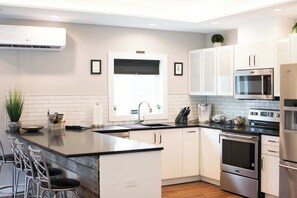 Fridge, microwave, oven, stovetop - Stylish Downtown Solar Home w/ Hot Tub & Billiards (Geneva)