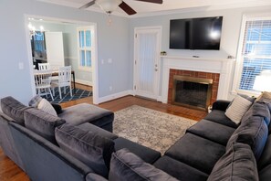 Smart TV, fireplace, books, printers