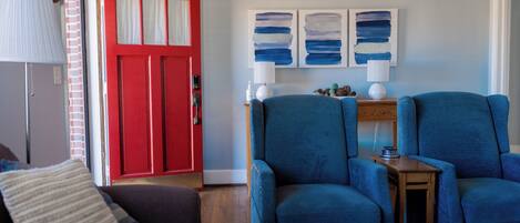 Smart TV, fireplace, books, printers