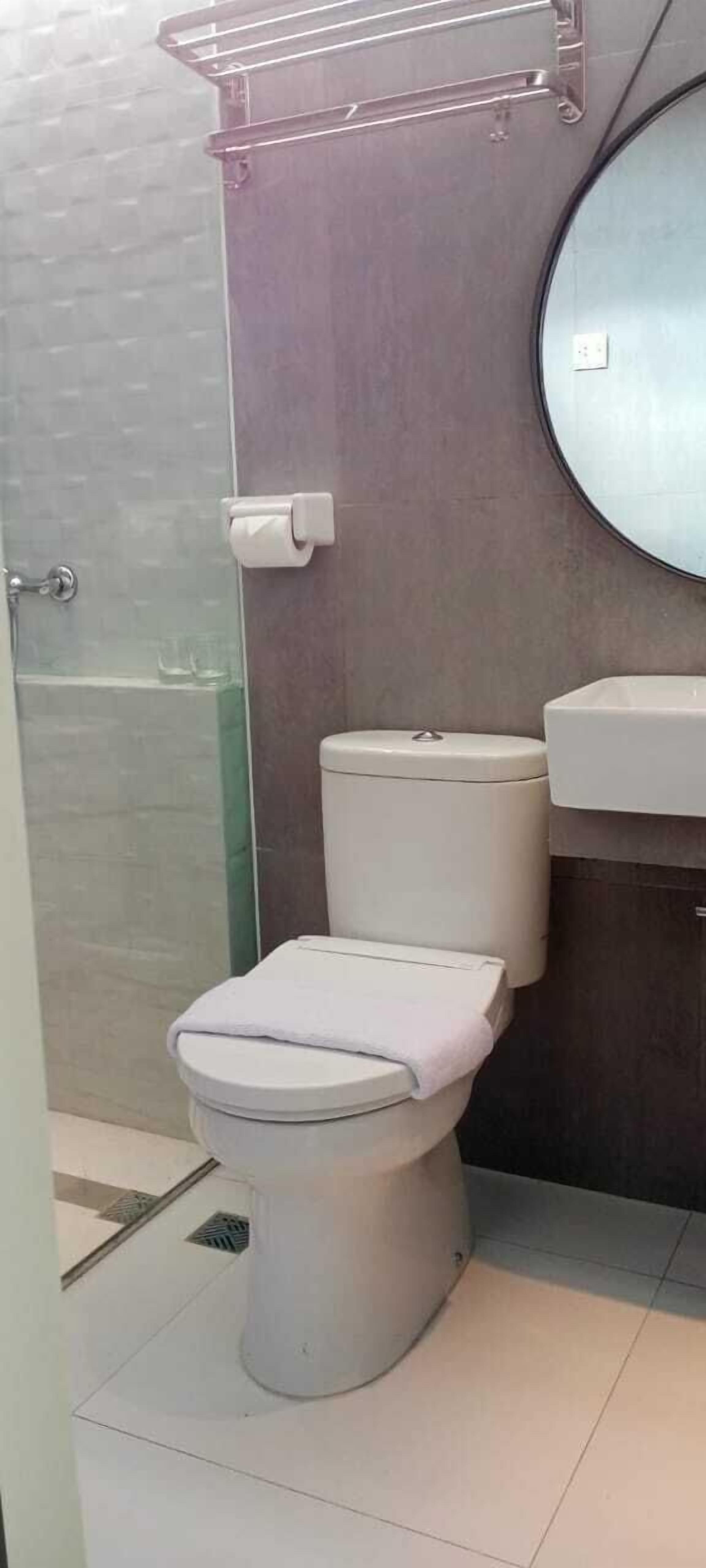 Shower, hair dryer, slippers, towels