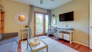 A living room with a sofa, a coffee table, a television, a ceiling fan, and a window with curtains. - 16 Mi to Beaches & Wineries! Chic Peaceful Retreat (Santa Paula)