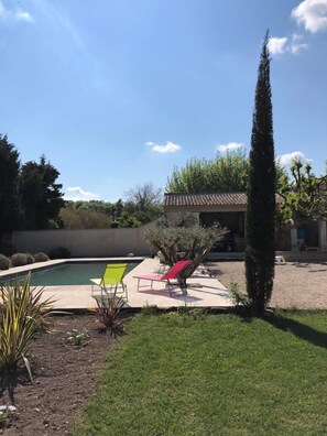 Seasonal outdoor pool, open 10:00 AM to 7:00 PM, pool loungers