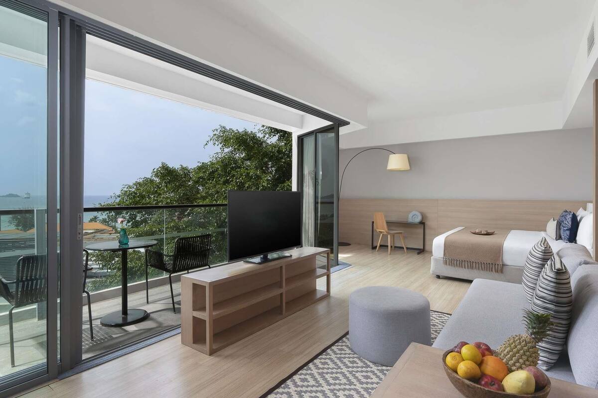 Junior Suite, 1 King Bed, Balcony | In-room safe, desk, laptop workspace, blackout drapes