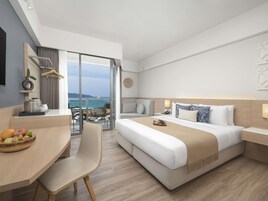 Deluxe Room, 1 King Bed, Balcony, Sea View | In-room safe, desk, laptop workspace, blackout drapes