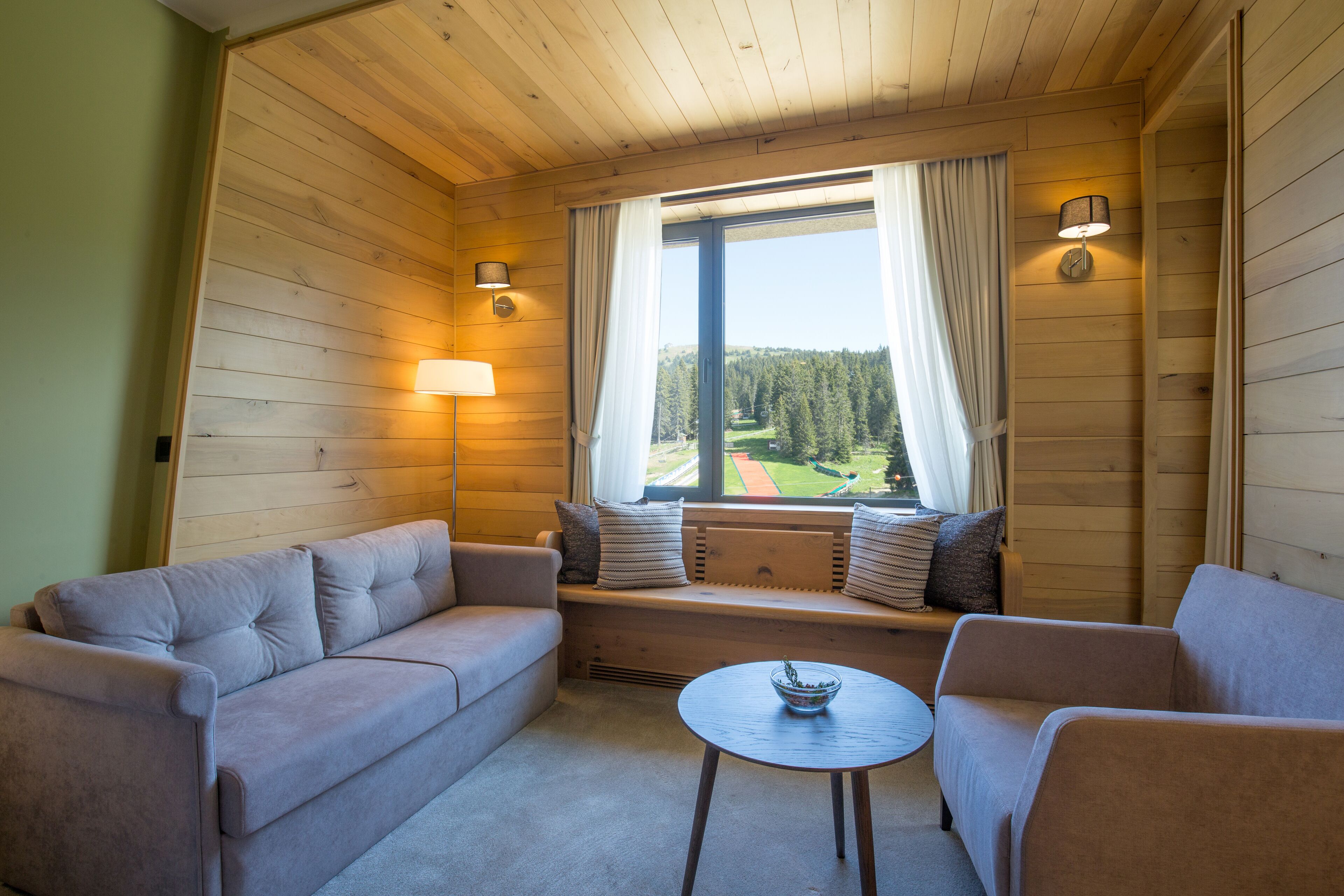 superior double or twin room | living area | flat-screen tv