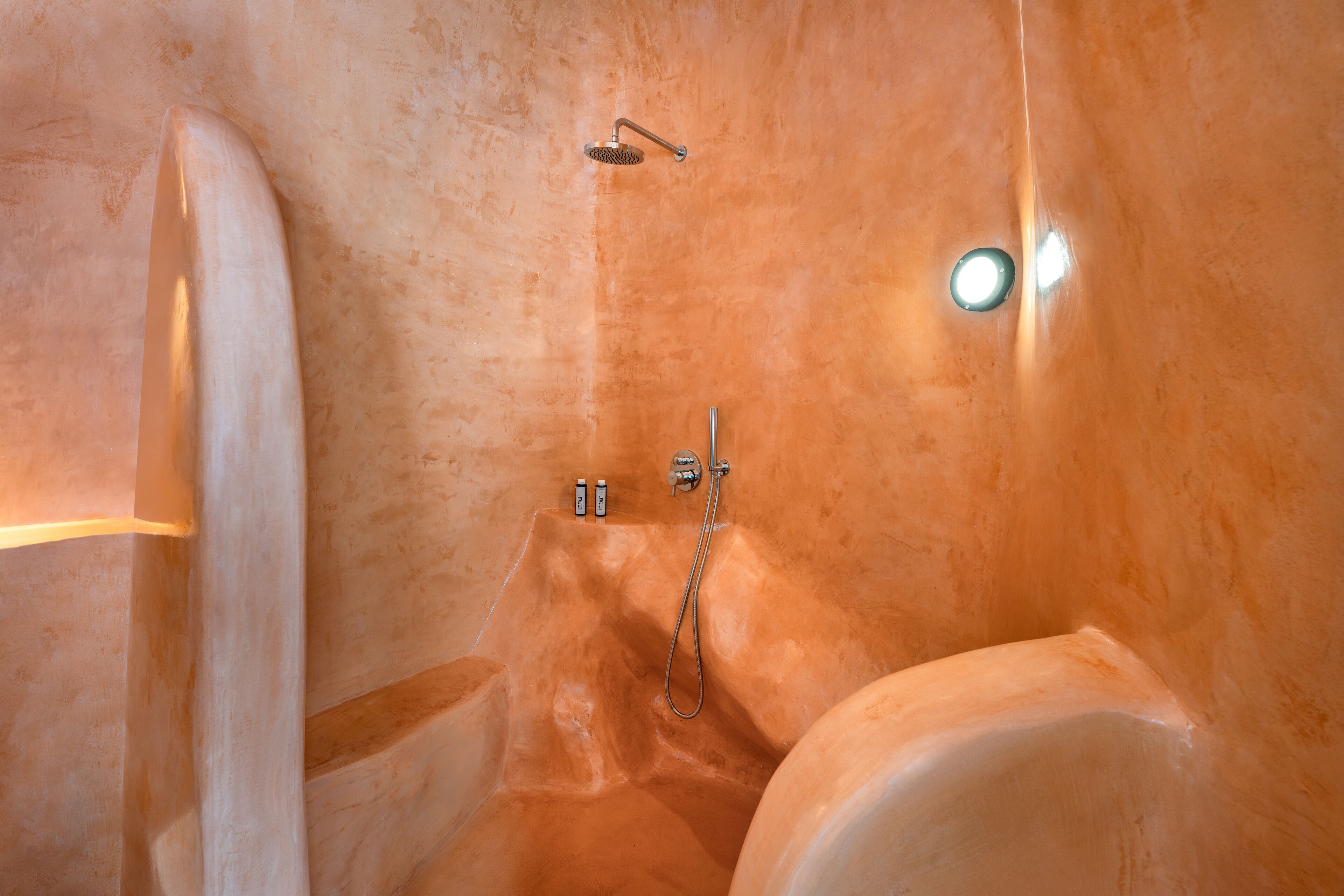 superior cave suite with private pool & sea view | bathroom | shower, rainfall showerhead, eco-friendly toiletries, hair dryer