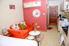 Individually furnished, desk, laptop workspace, iron/ironing board