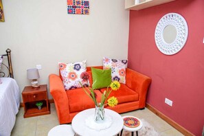 32-inch flat-screen TV with premium TV channels, TV - Sherry Homes West suites (Nairobi)