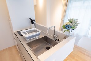 Deluxe Condo | Private kitchen | Fridge, microwave, stovetop, coffee/tea maker - feel Asakusa Stay (Tokyo)