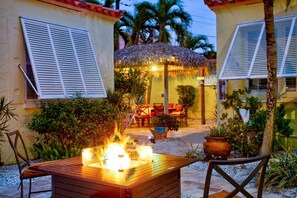 Terrace/patio - 1BR Cottage Easy Walk to the Beach! Heated Pool, Kayaks, Bikes, & $400 in Free Fun Activities. (Madeira Beach)