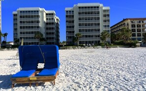 On the beach, sun-loungers