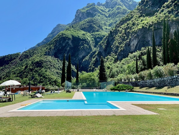Seasonal outdoor pool, pool umbrellas, pool loungers