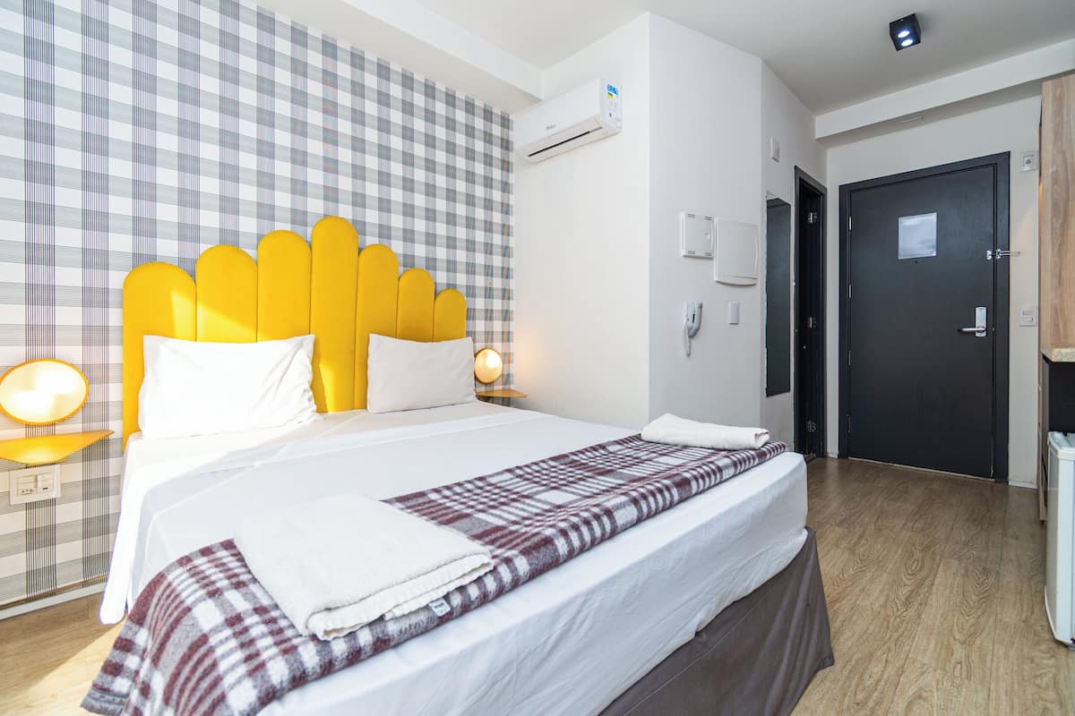 Classic Studio | Premium bedding, desk, laptop workspace, blackout drapes