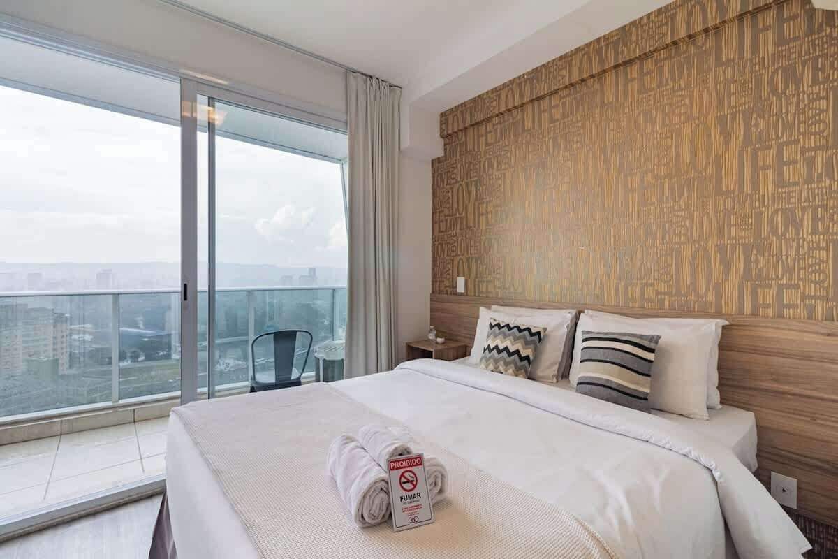 Premium bedding, desk, laptop workspace, blackout drapes