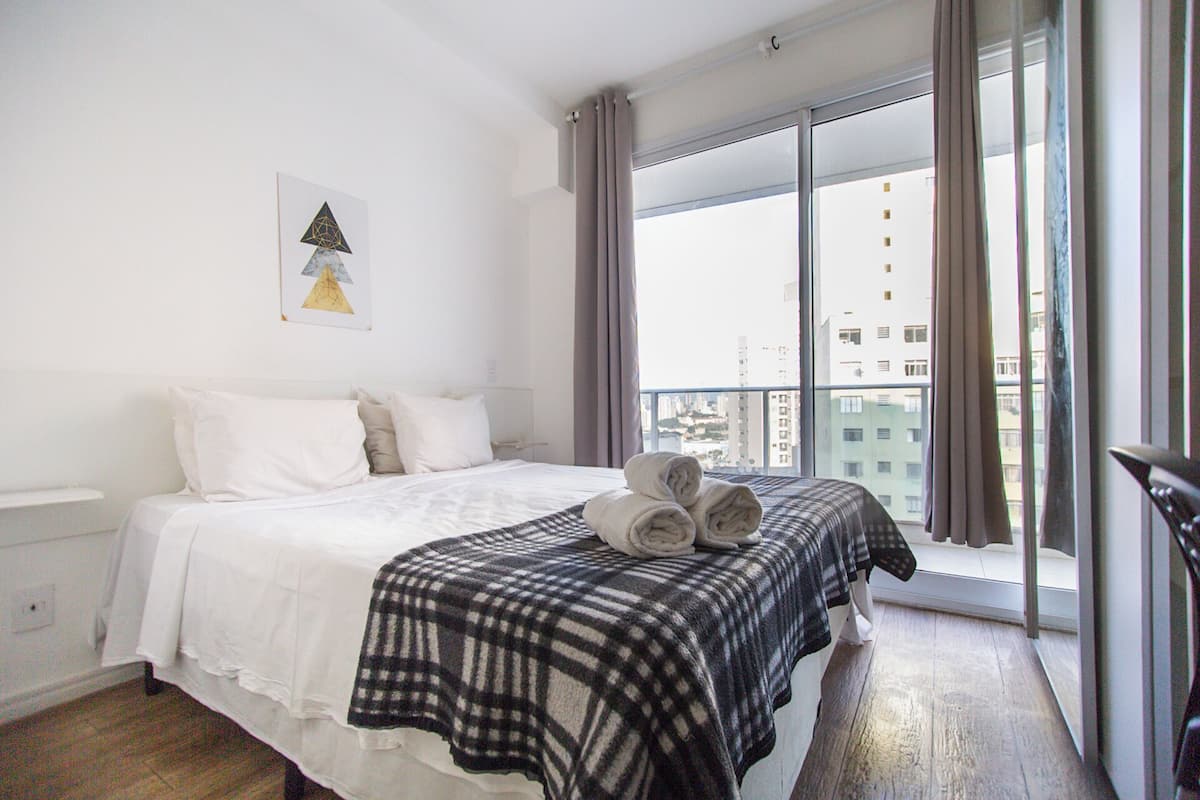 Comfort Studio | Premium bedding, desk, laptop workspace, blackout drapes