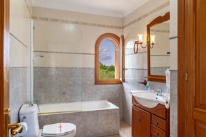 Bathtub, hair dryer, towels