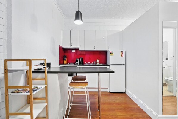 Fridge, microwave, stovetop, coffee/tea maker