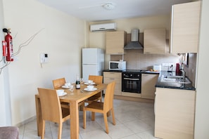 Fridge, microwave, oven, stovetop - Apt. Kyla, Lovely 2BDR Ayia Napa Apt with Communal Pool, Close to Nissi Avenue (Ayia Napa)