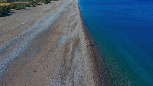 On the beach, sun loungers, beach towels