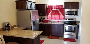 Fridge, microwave, oven, cookware/dishes/utensils - Stylish 3BR House in Ocho Rios w/AC, Pool & Gym (Ocho Rios)