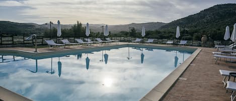 Seasonal outdoor pool, open 6:30 AM to 6:30 PM, sun loungers