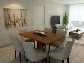 Enjoy meals in this dining area with a large window and sliding glass door leading to an outdoor space.
