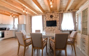 Fridge, stovetop, dishwasher, coffee/tea maker