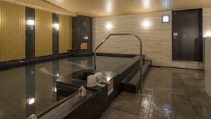 A modern indoor pool area with a glass barrier, a metal handrail, and a black door. - APA Hotel Nagoya Ekimae Kita (Nagoya)