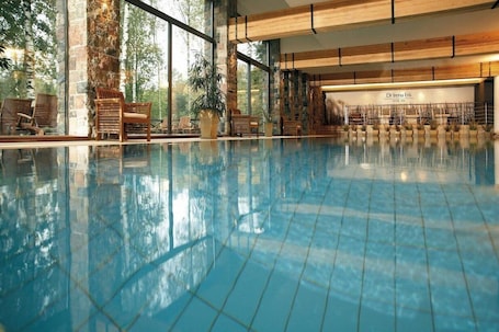 Indoor pool, open 7:00 AM to 10:00 PM, sun loungers