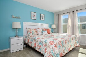 A bedroom with a bed, nightstands, a dresser, a window with curtains, and wall art. - Lovely 4Bd Townhome Near Disney @ Compass Bay 5122 (Kissimmee)