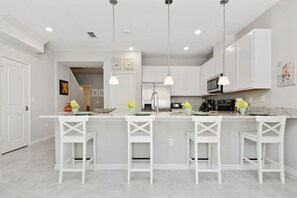 Townhome, 4 Bedrooms | Private kitchen | Full-sized fridge, microwave, oven, stovetop